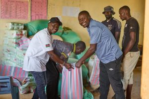 Moses and Titus serving food